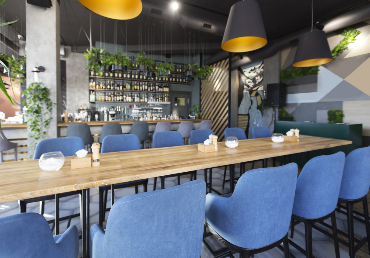 Interior of cozy cafe. Contemporary design in loft style, modern dining place and bar counter, copy space
